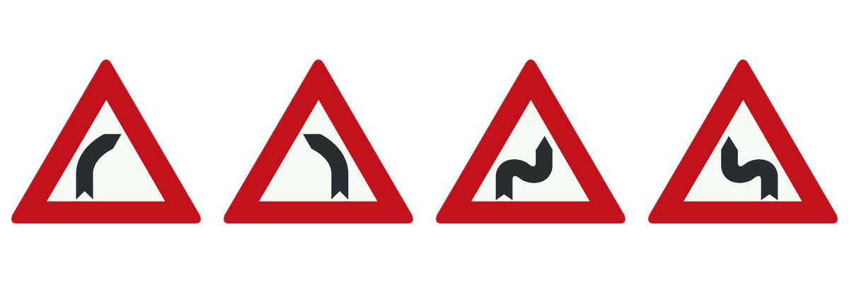 Vier officiële borden voor bochten